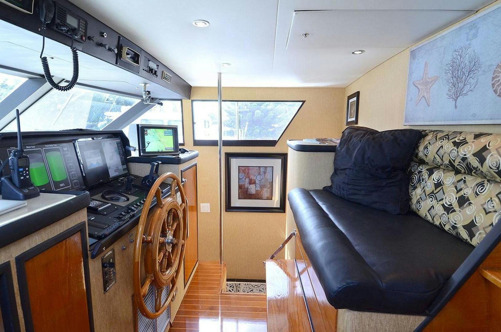a living room with a couch and a tv aboard GOLDEN GIRL Yacht for Sale