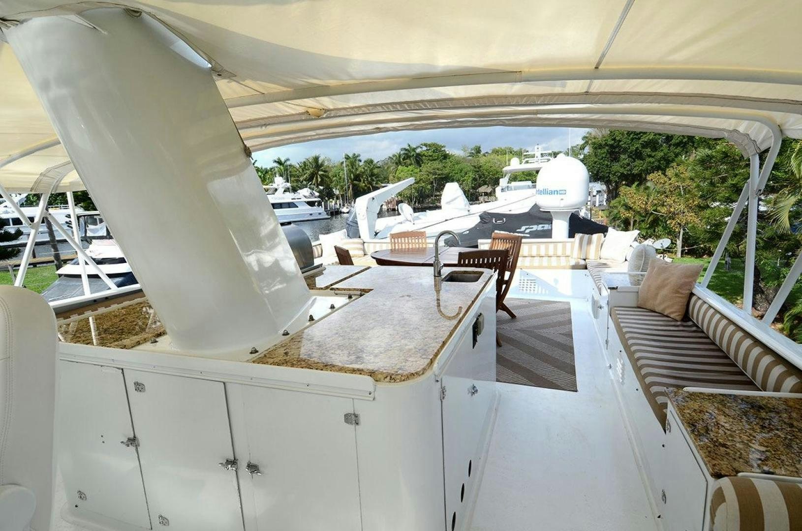 a room with a table and chairs aboard GOLDEN GIRL Yacht for Sale