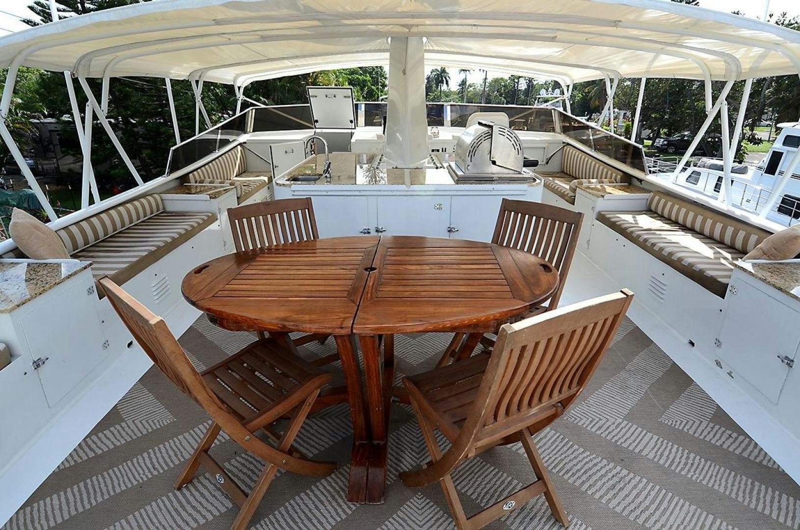 a table and chairs on a deck aboard GOLDEN GIRL Yacht for Sale