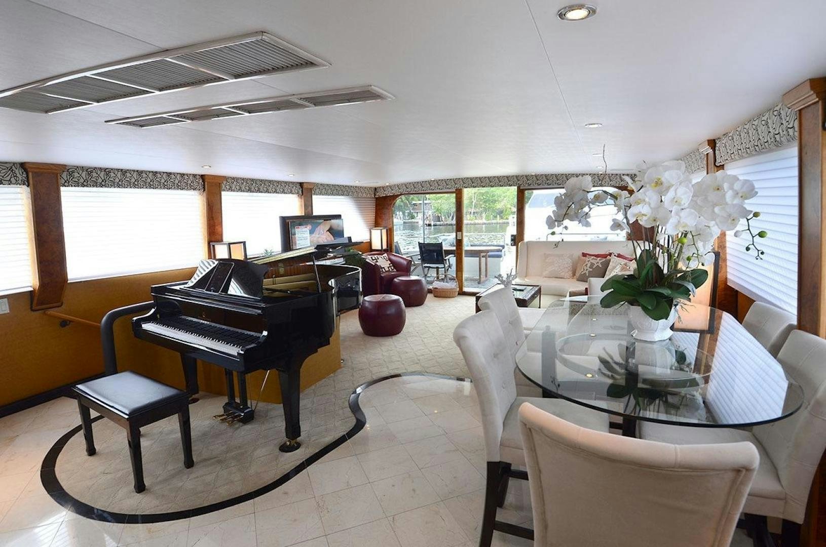 a piano in a room aboard GOLDEN GIRL Yacht for Sale