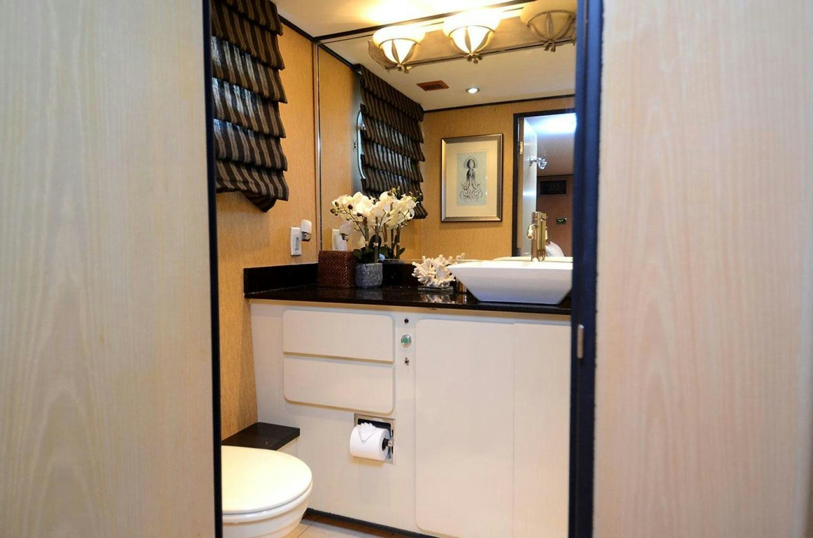 a bathroom with a sink and toilet aboard GOLDEN GIRL Yacht for Sale
