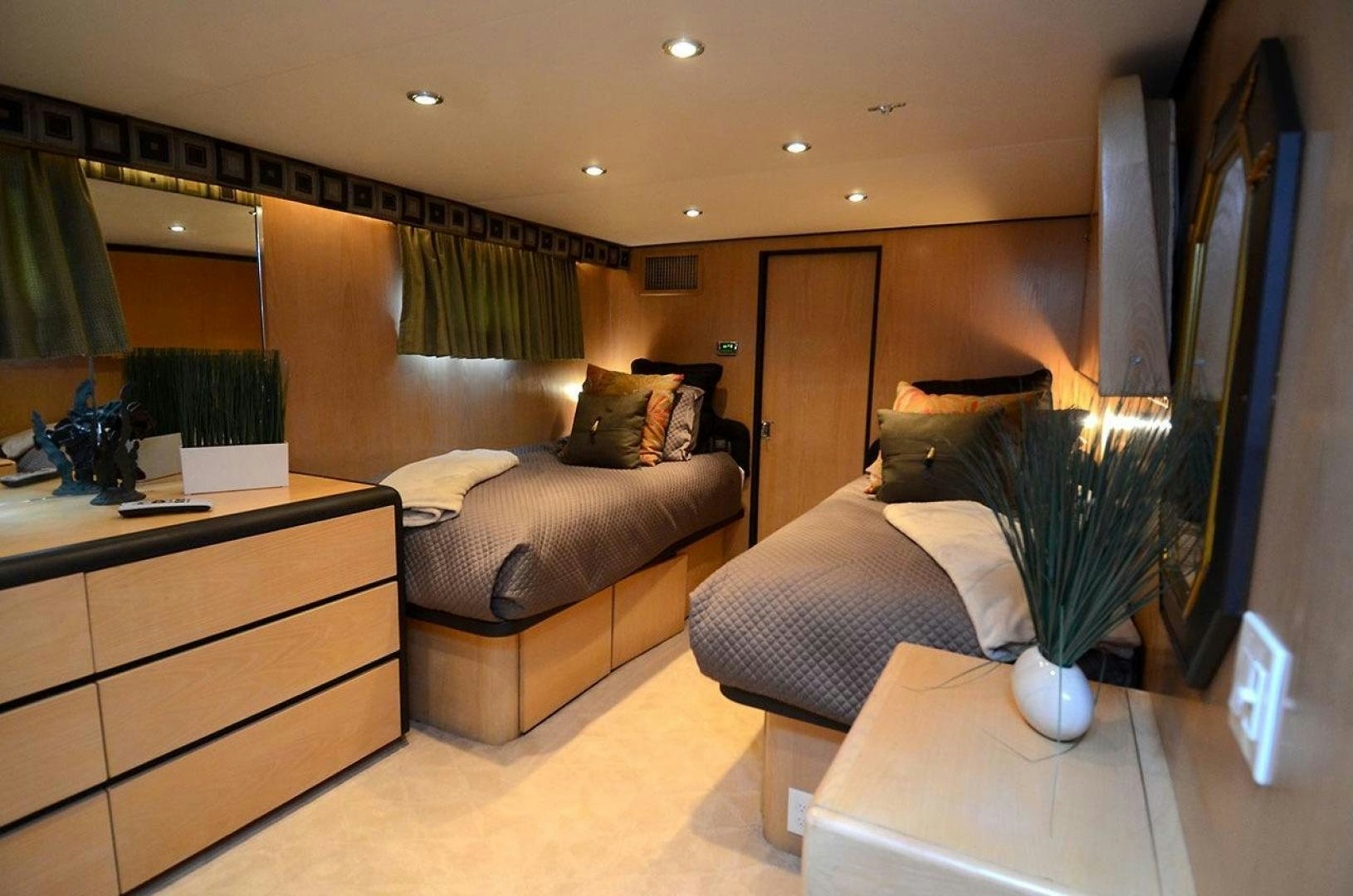 a living room with a large mirror aboard GOLDEN GIRL Yacht for Sale