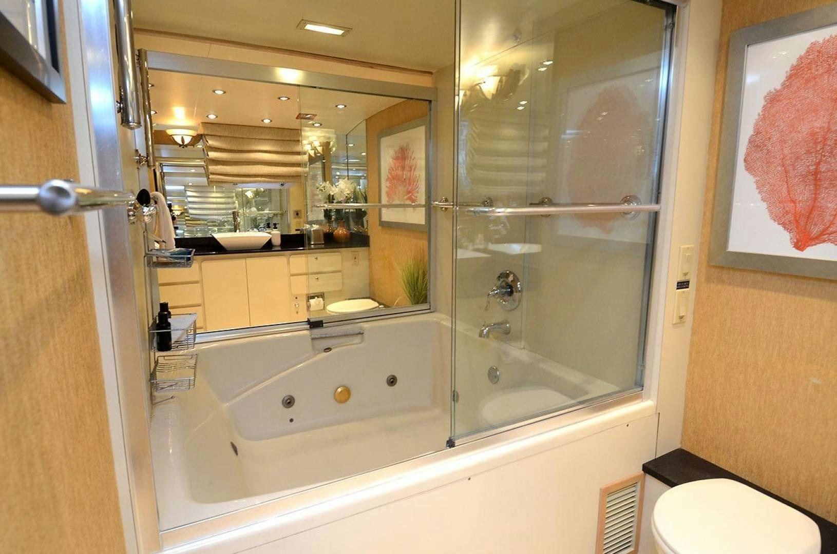 a bathroom with a glass shower aboard GOLDEN GIRL Yacht for Sale