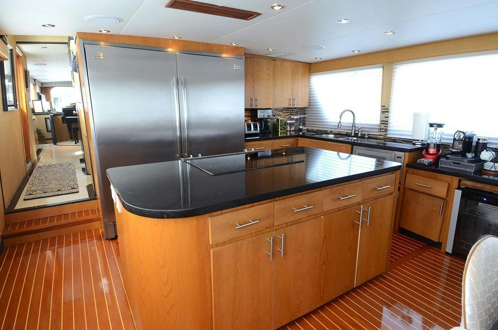a kitchen with a stainless steel refrigerator aboard GOLDEN GIRL Yacht for Sale
