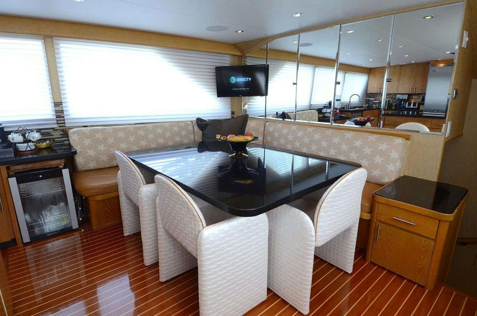 a room with a table and chairs aboard GOLDEN GIRL Yacht for Sale