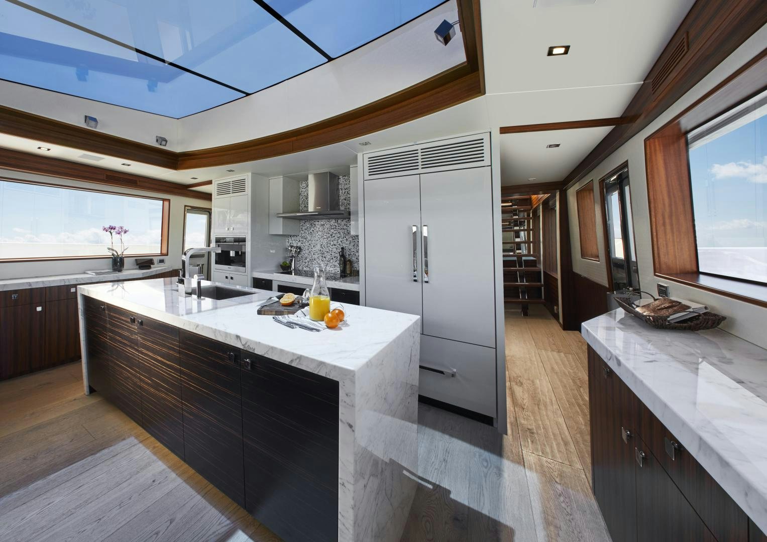 a kitchen with a large island aboard M90 PANACERA Yacht for Sale