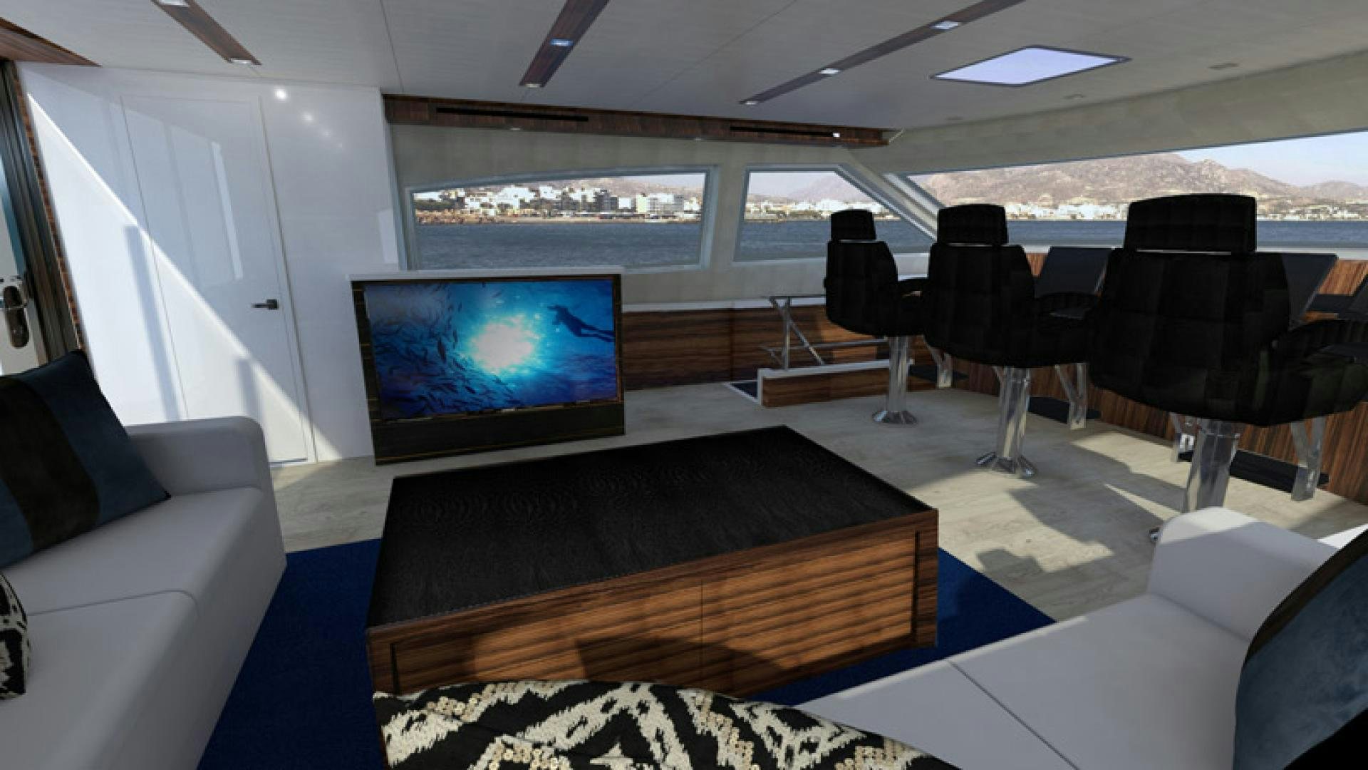 a room with a tv and chairs aboard NO NAME Yacht for Sale