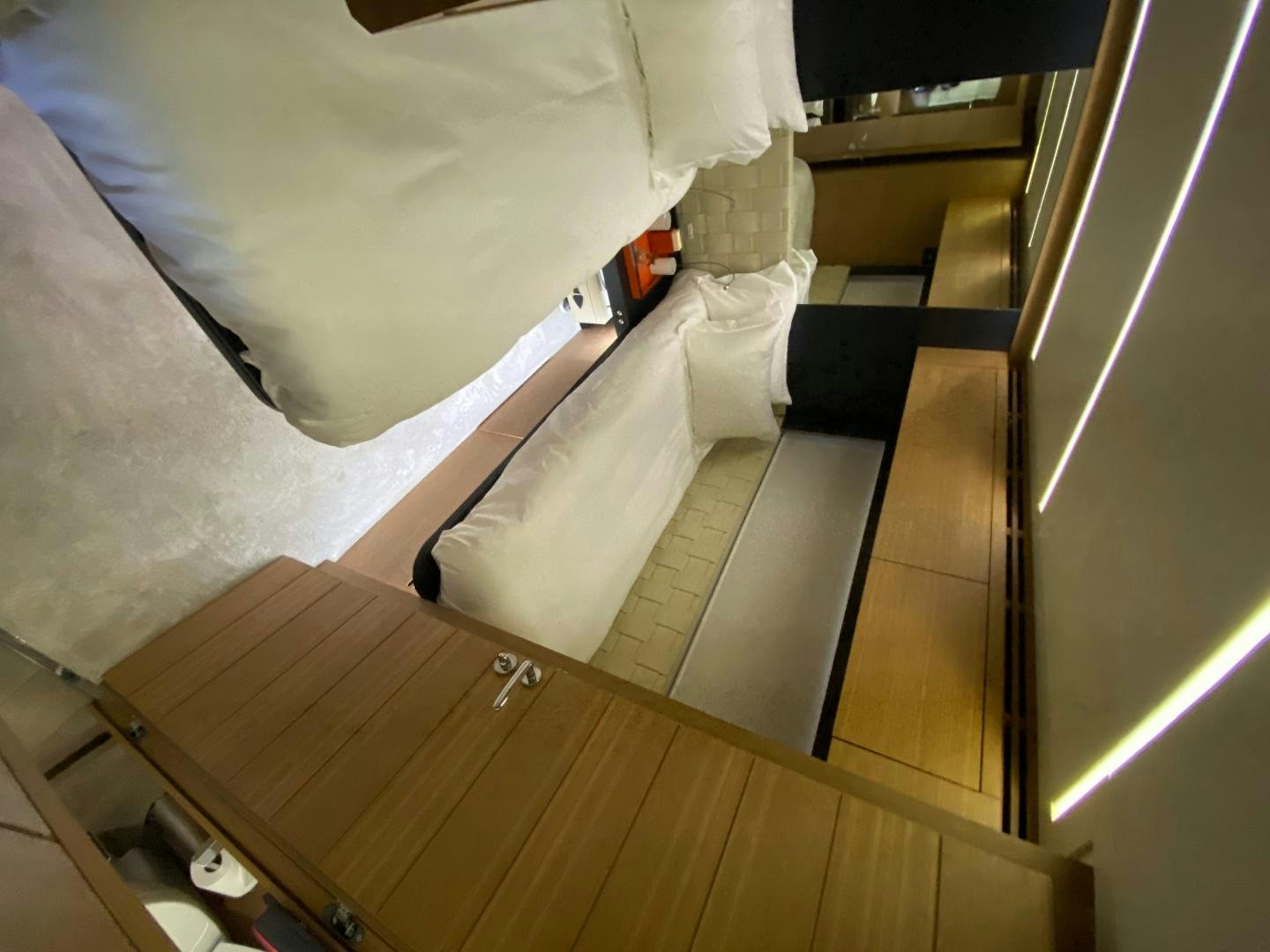 a room with a bed and a chair aboard NO NAME Yacht for Sale