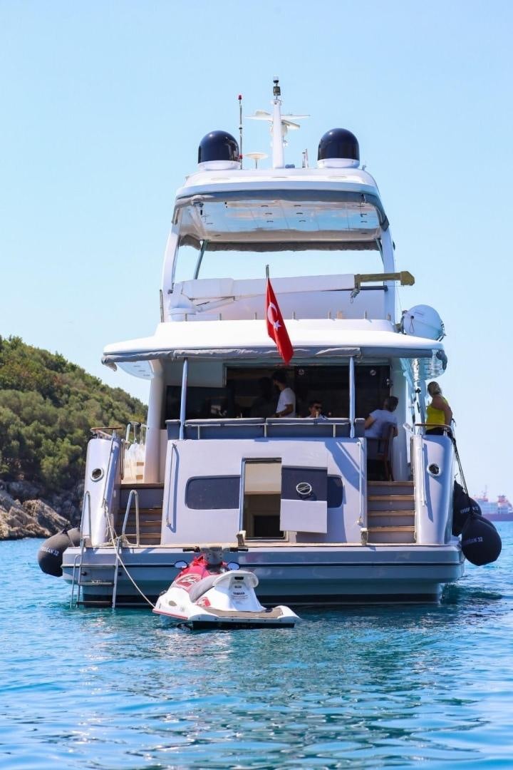 a large white boat with a red stripe on the front aboard NO NAME Yacht for Sale