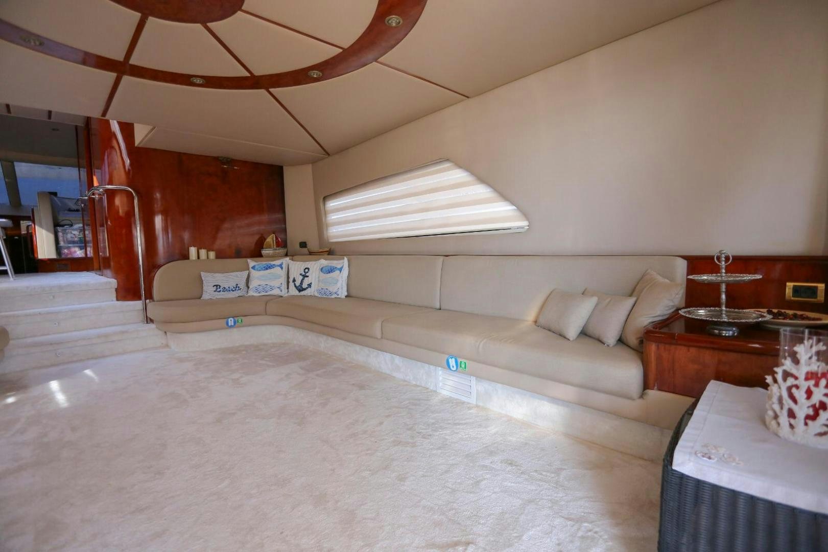 a living room with a couch and a staircase aboard NO NAME Yacht for Sale