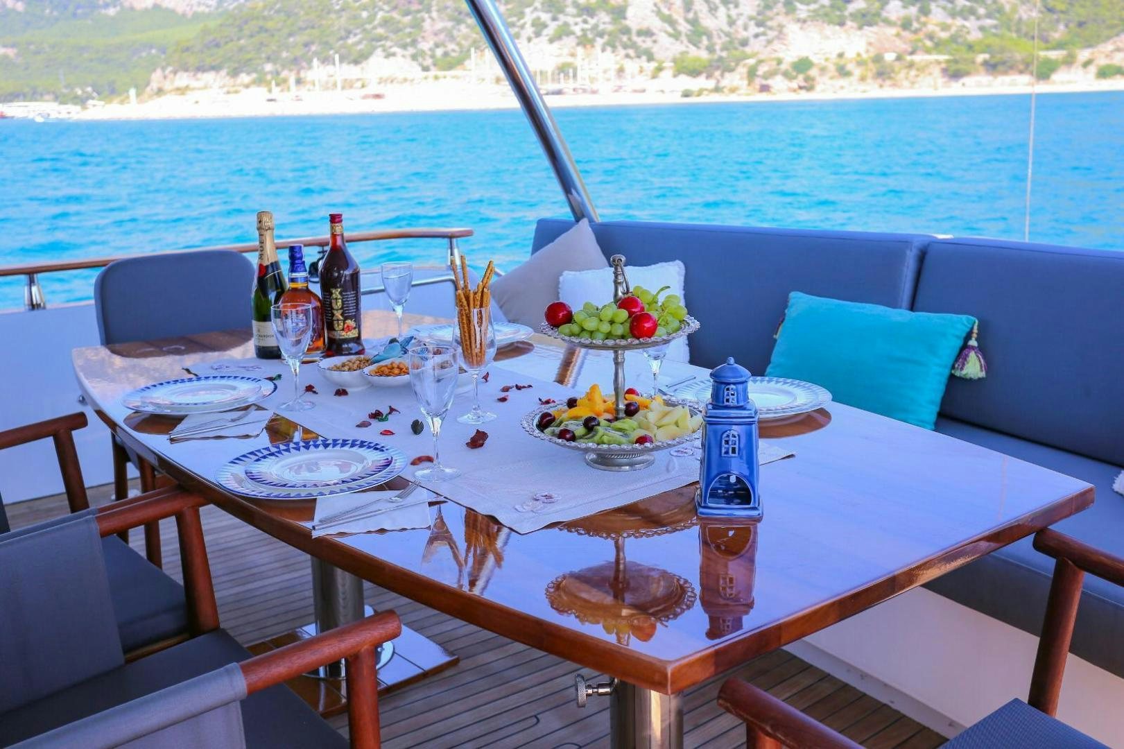 a table with food and drinks on it aboard NO NAME Yacht for Sale