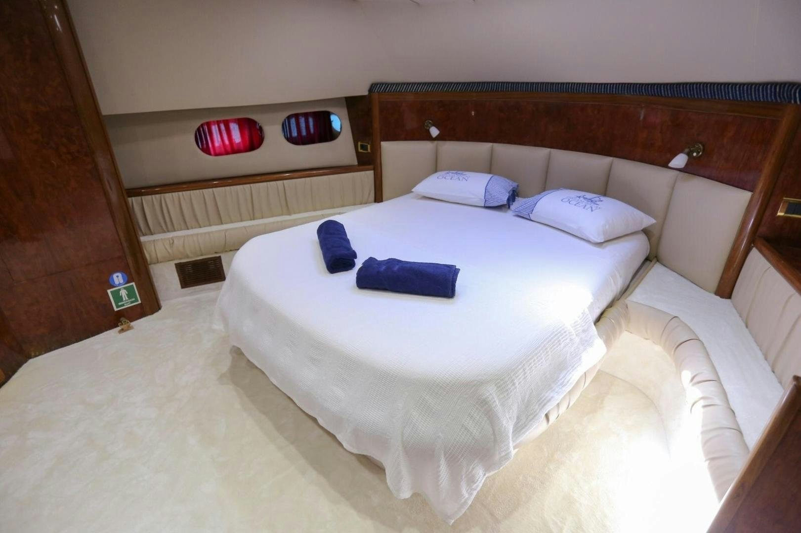 a bed with white sheets and pillows aboard NO NAME Yacht for Sale