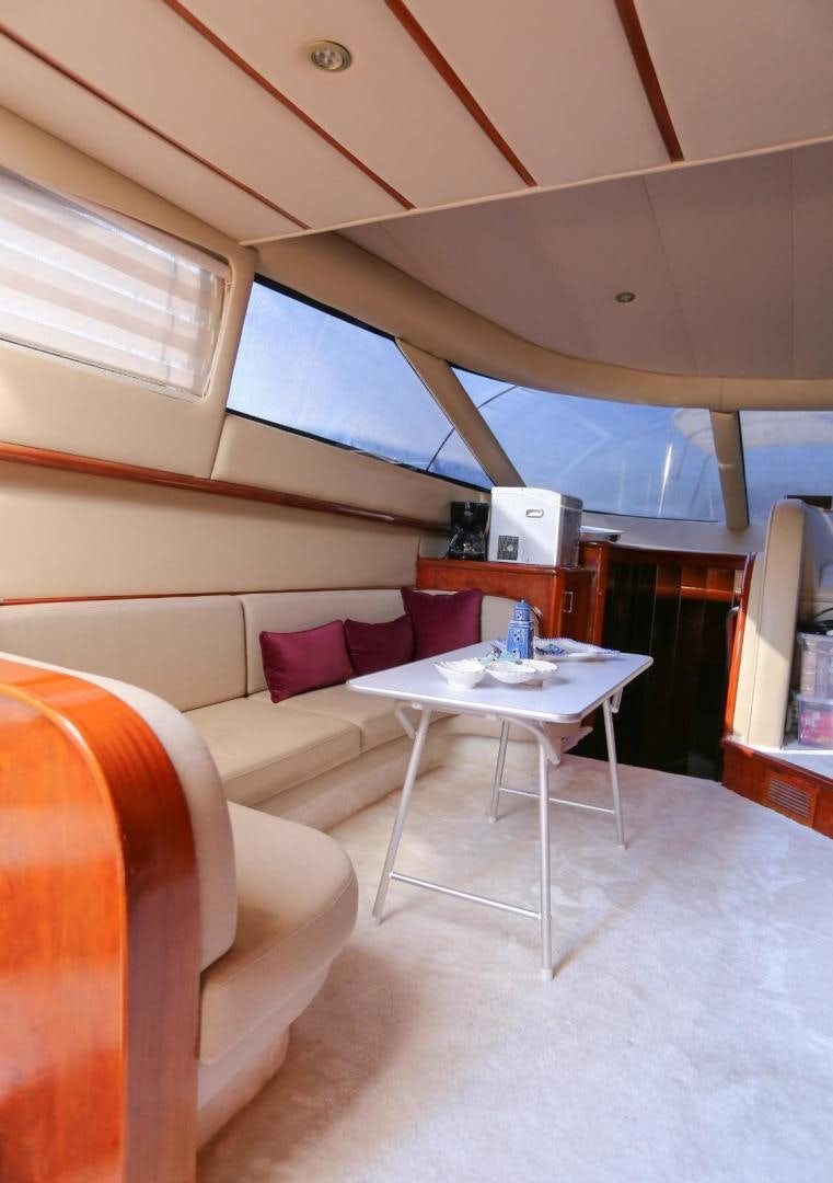 a room with a table and chairs aboard NO NAME Yacht for Sale