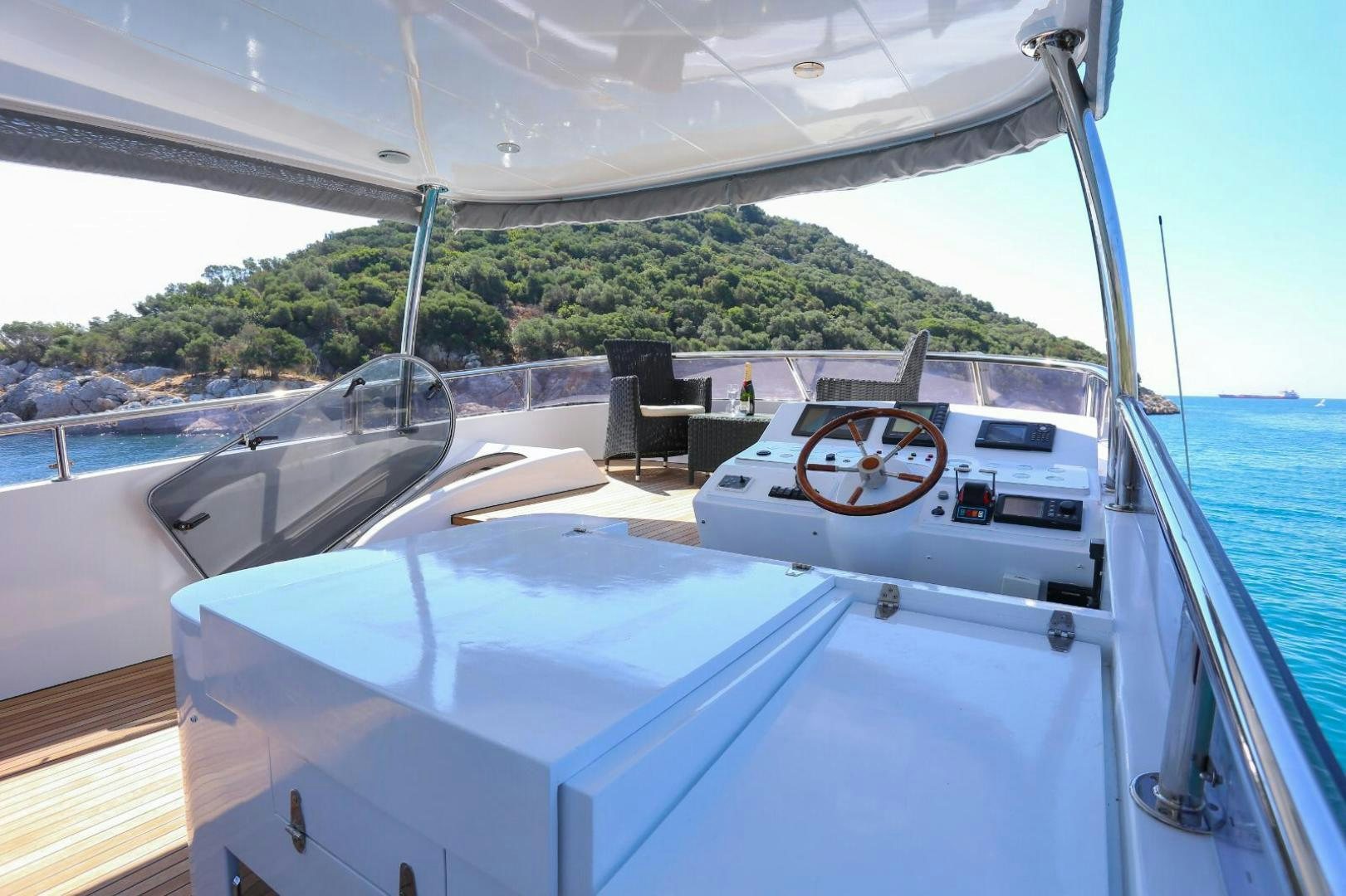 a boat with a steering wheel aboard NO NAME Yacht for Sale
