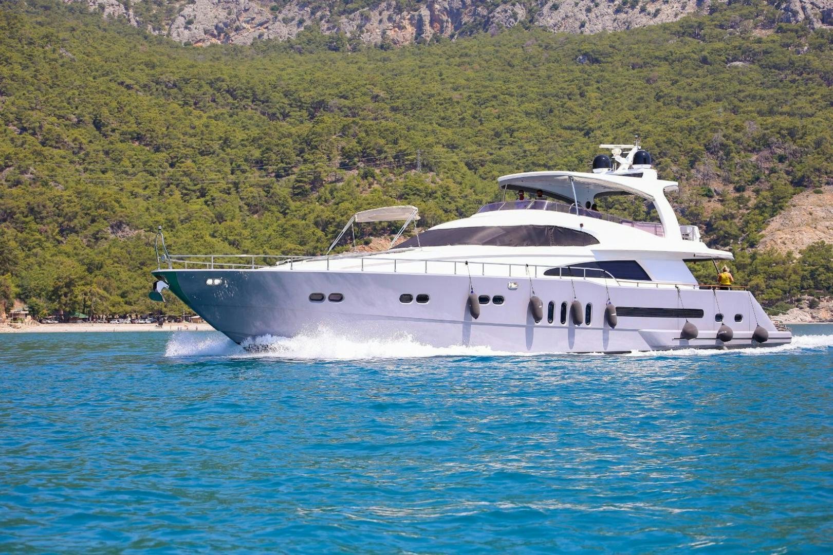 a white yacht on the water aboard No Name Yacht for Sale