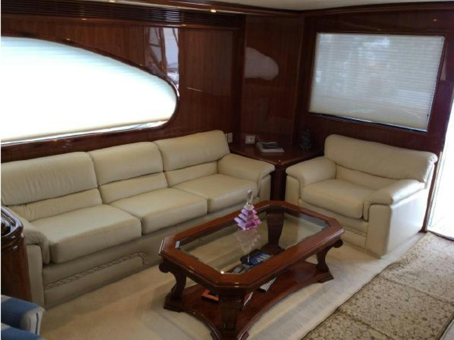 a living room with a couch and a coffee table aboard NO NAME Yacht for Sale