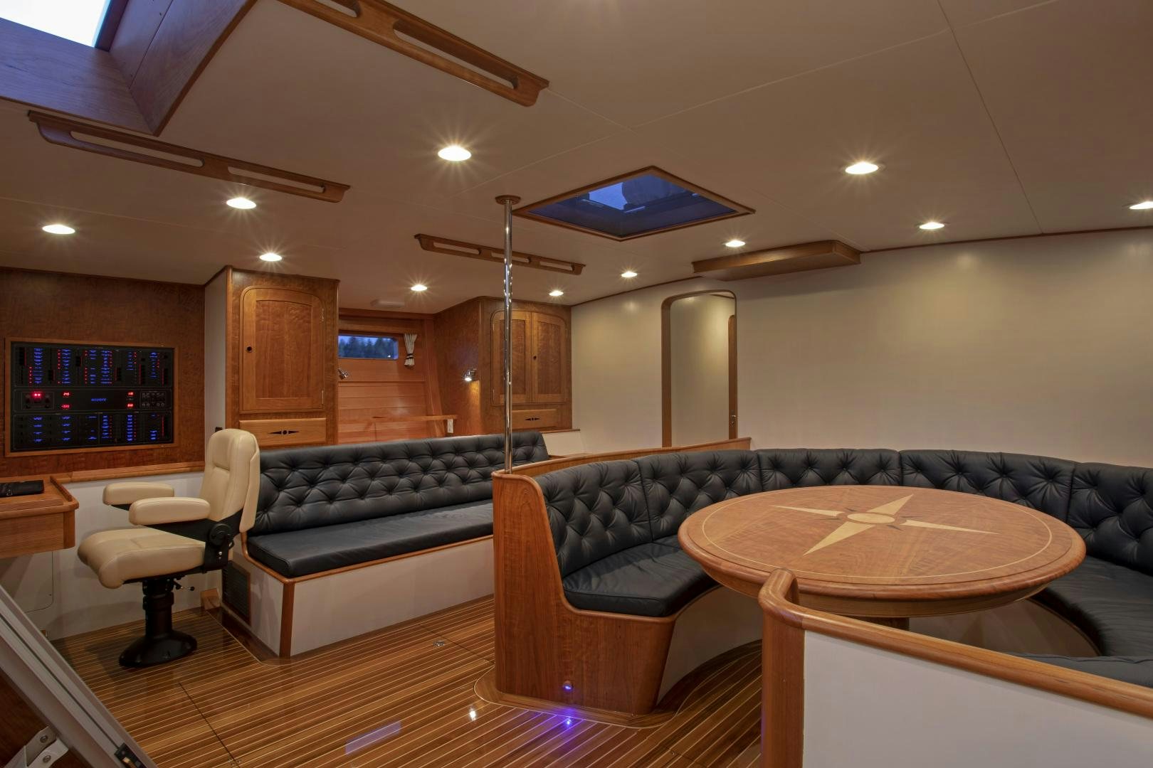 a living room with a couch and a table aboard SONNY III Yacht for Sale