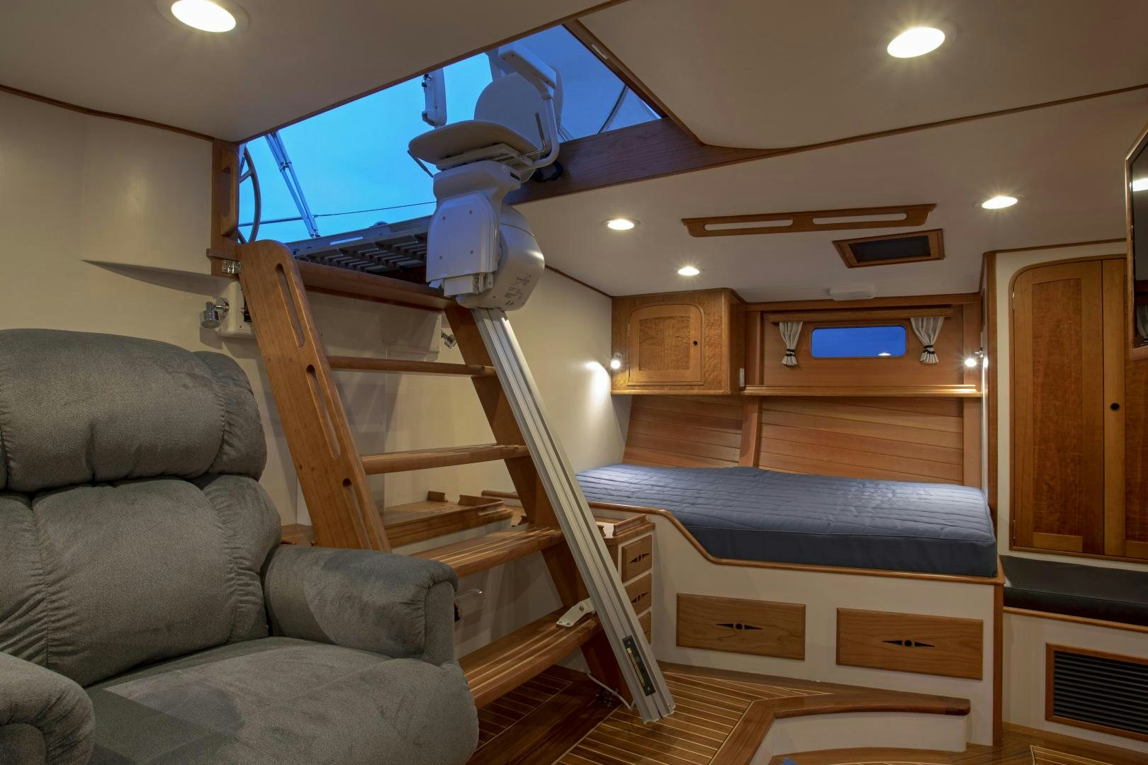 a living room with a couch and a piano aboard SONNY III Yacht for Sale