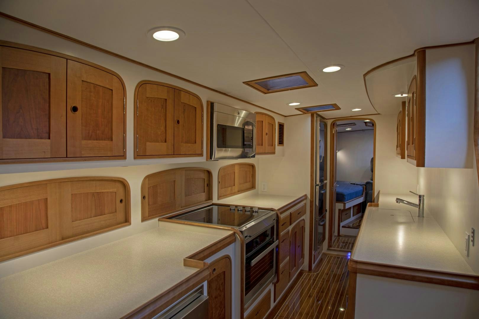 a kitchen with a stove and oven aboard SONNY III Yacht for Sale