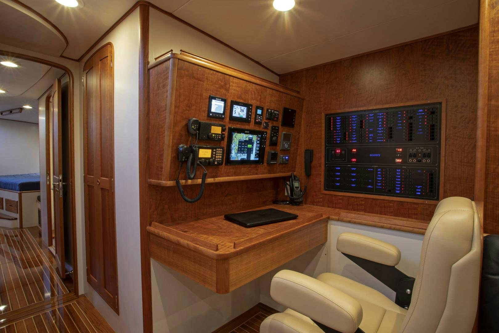 a room with a desk and chairs aboard SONNY III Yacht for Sale