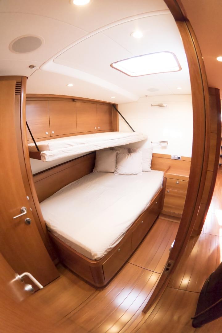 a room with a bed and a closet aboard B5 Yacht for Sale