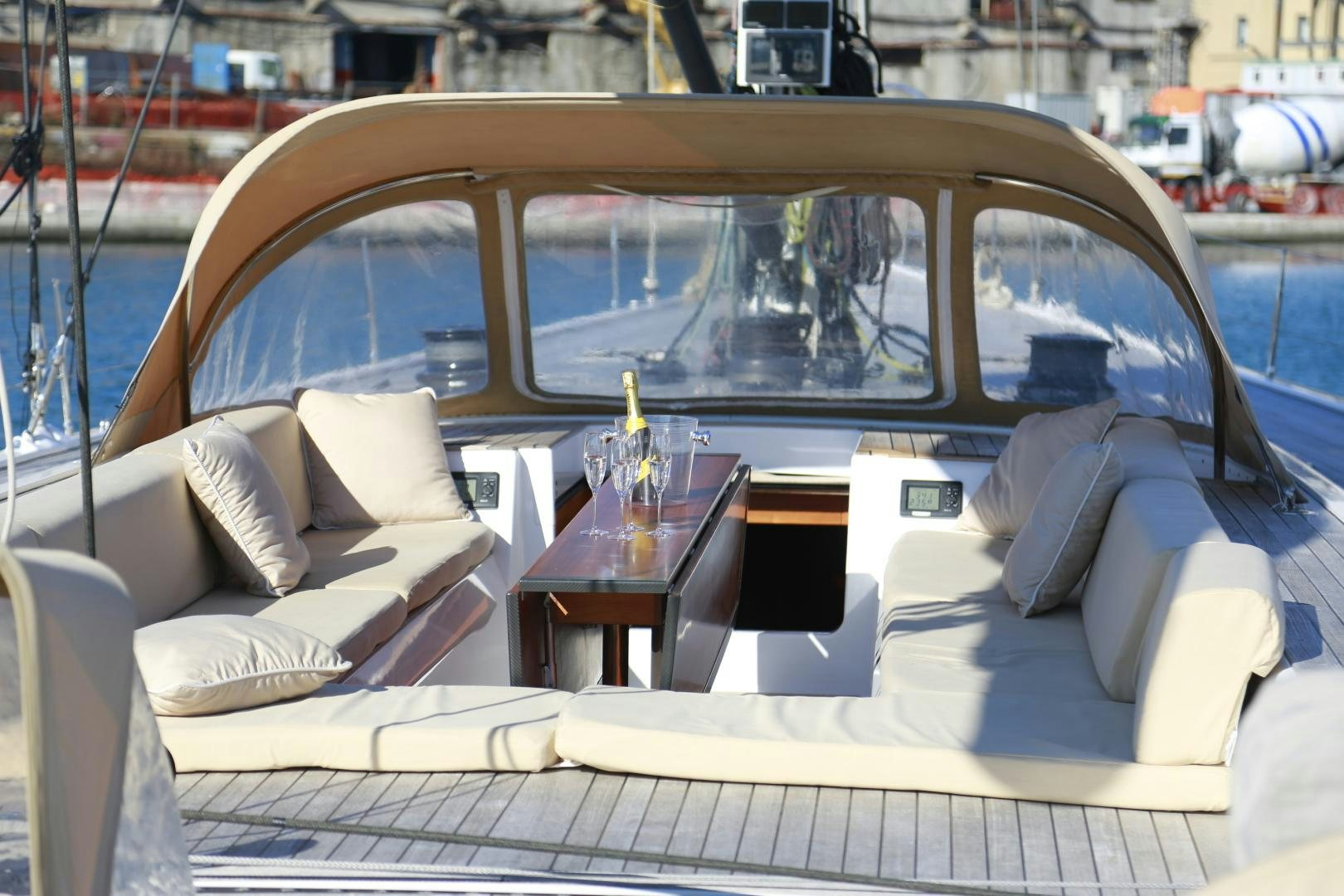 a boat with a table and chairs aboard B5 Yacht for Sale