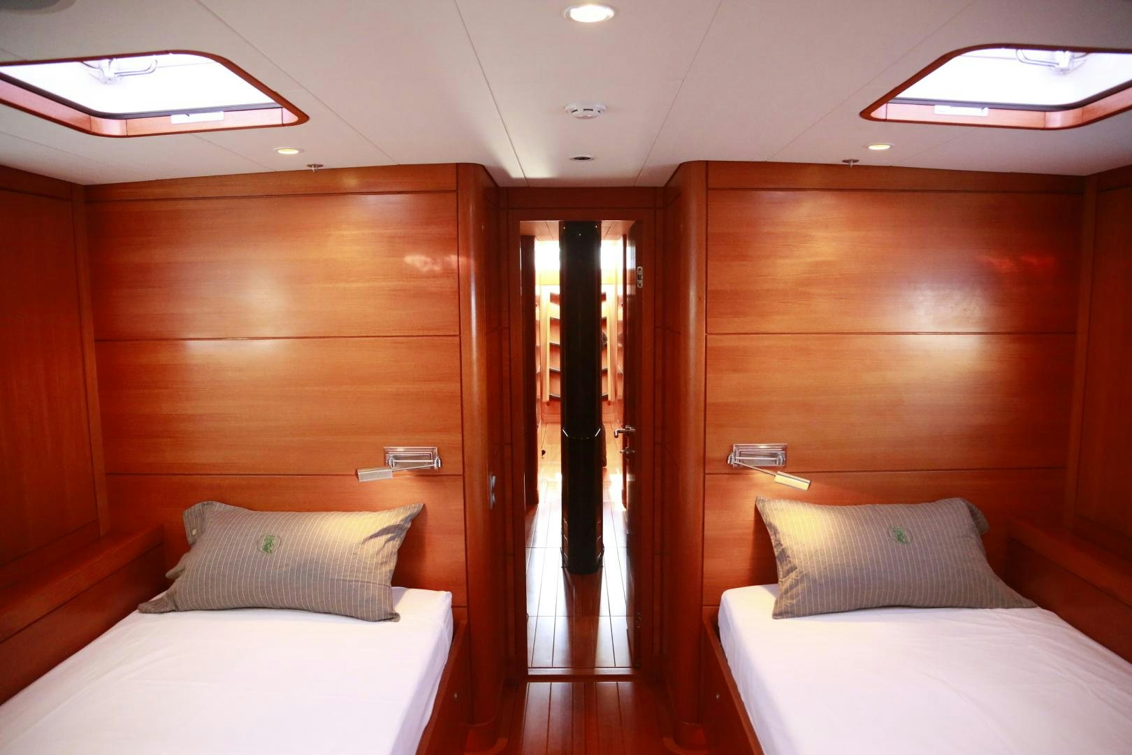 a room with a bed and a door aboard B5 Yacht for Sale