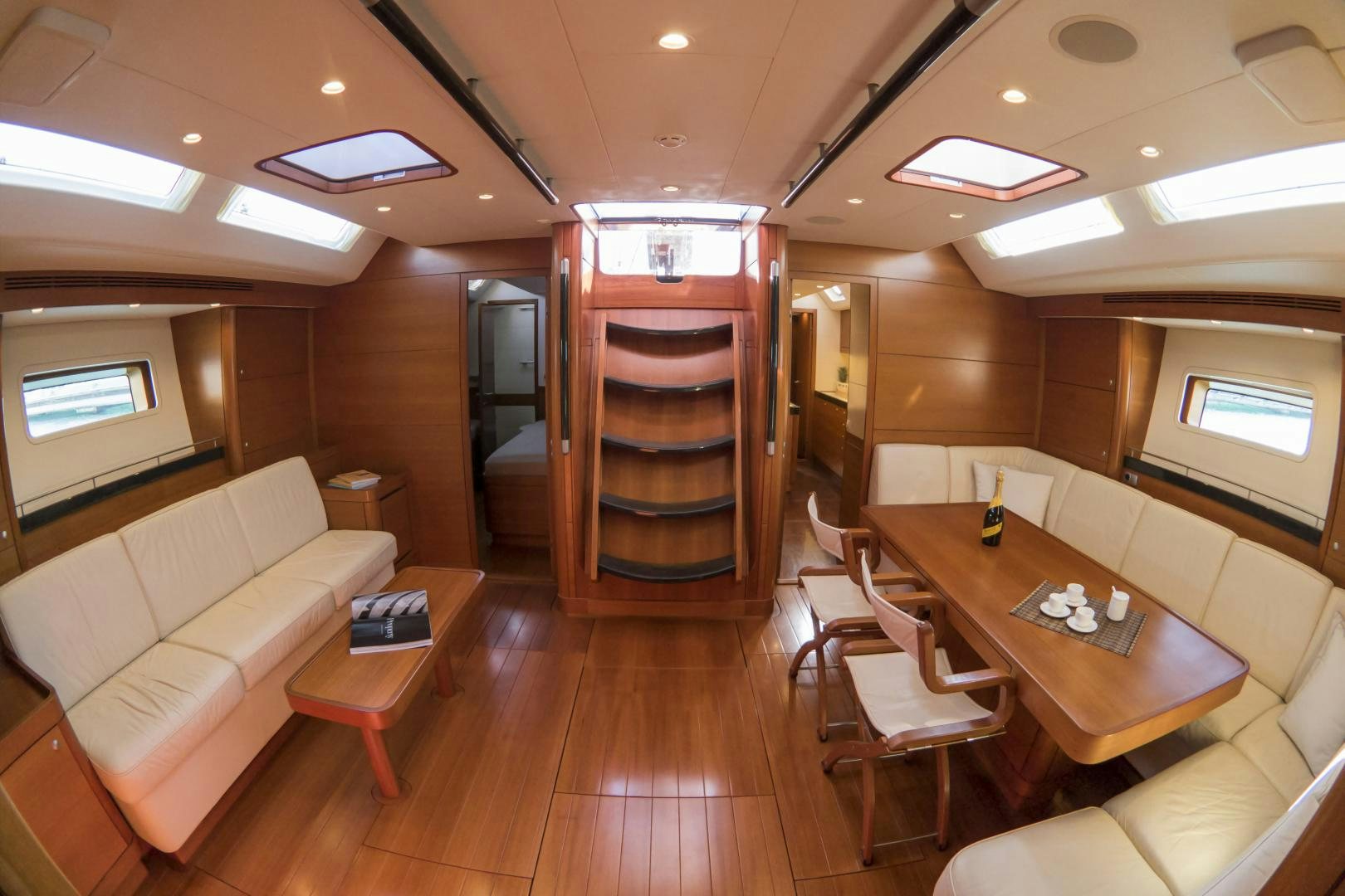 a room with a bed and a desk aboard B5 Yacht for Sale