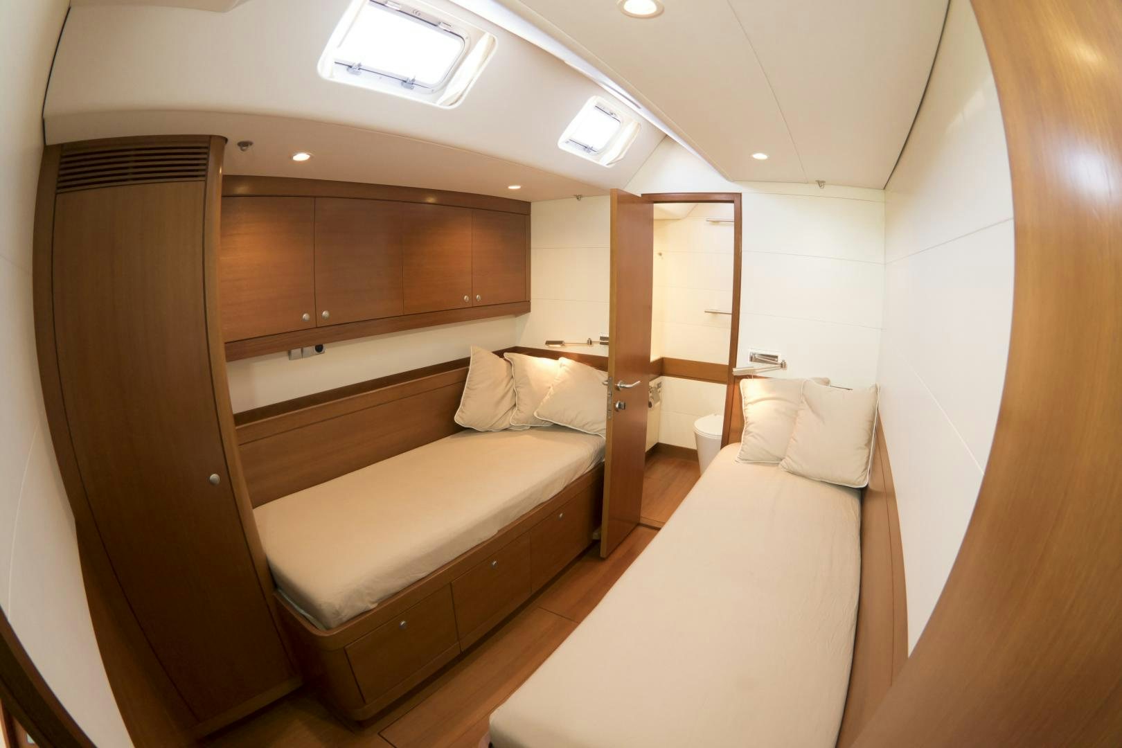 a room with a bed and a closet aboard B5 Yacht for Sale