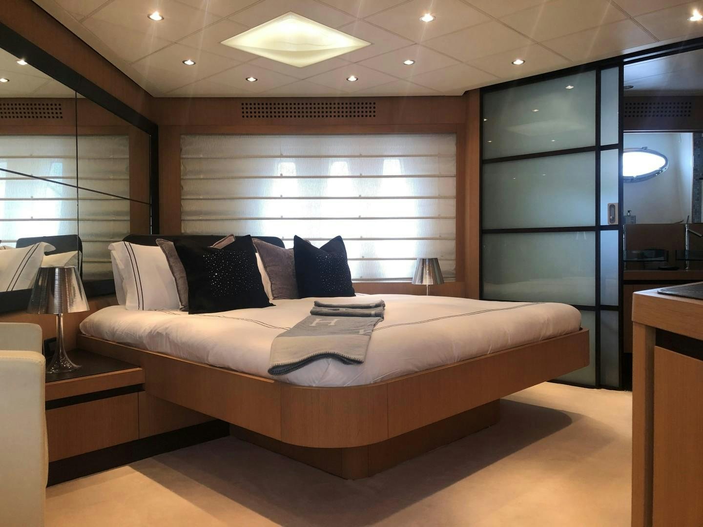a bed in a room aboard YCM 90 Yacht for Sale
