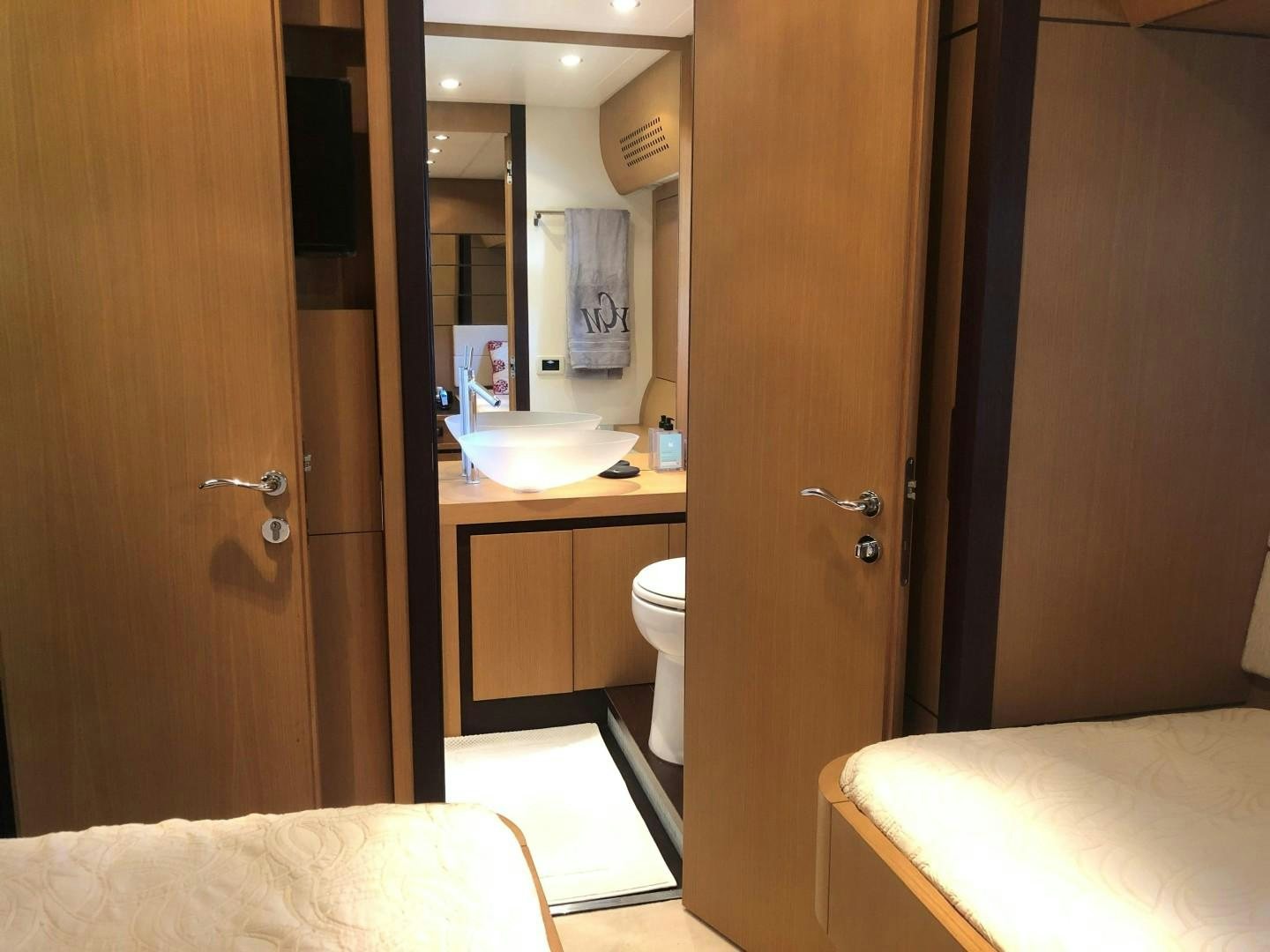 a bathroom with a sink and a mirror aboard YCM 90 Yacht for Sale