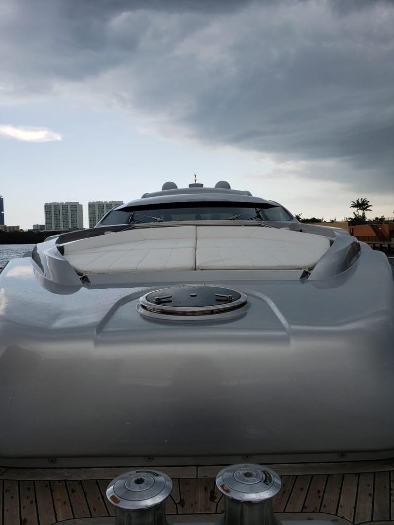 a white car with a large spoiler aboard YCM 90 Yacht for Sale
