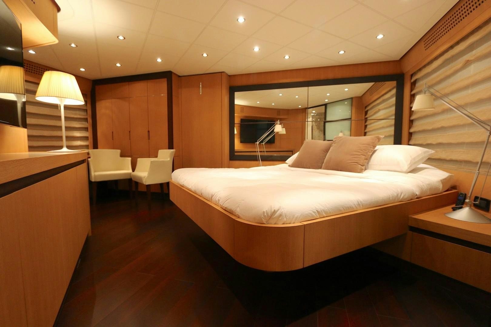 a bed in a room aboard YCM 90 Yacht for Sale