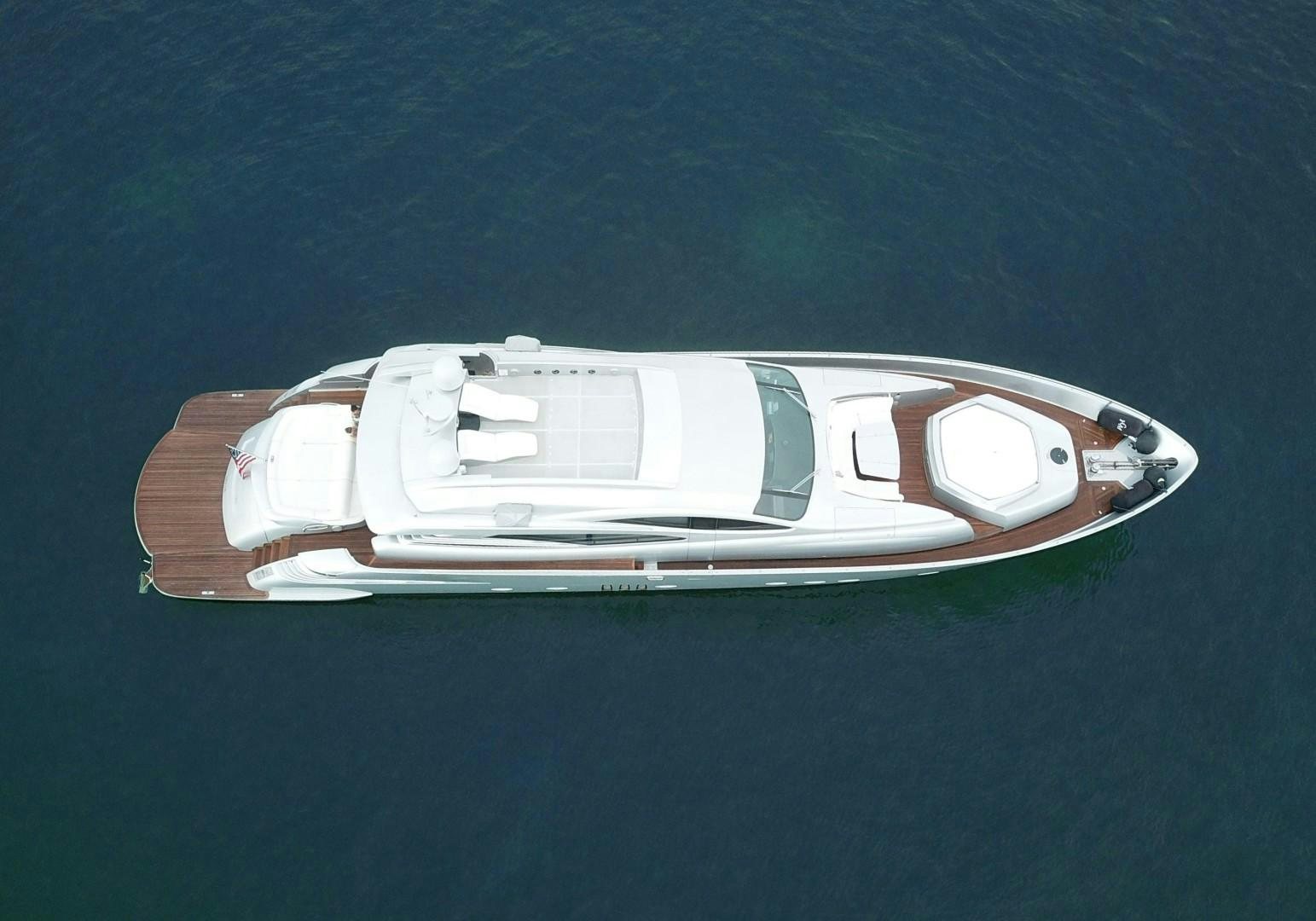a white car on a blue surface aboard YCM 90 Yacht for Sale