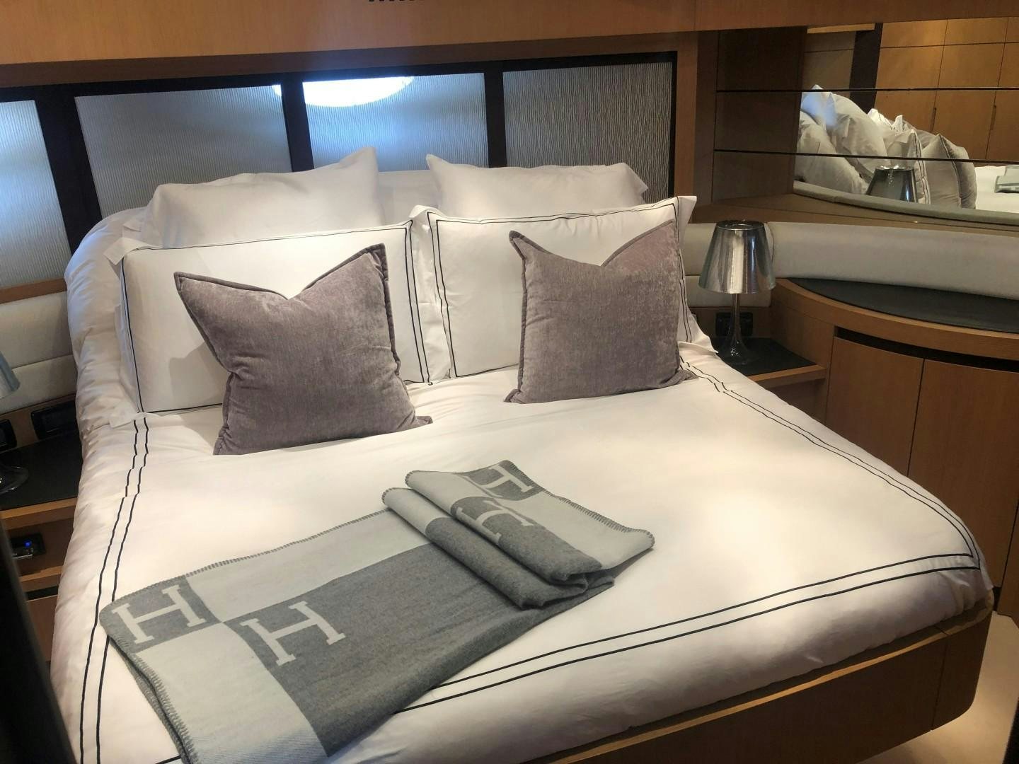 a bed with pillows aboard YCM 90 Yacht for Sale