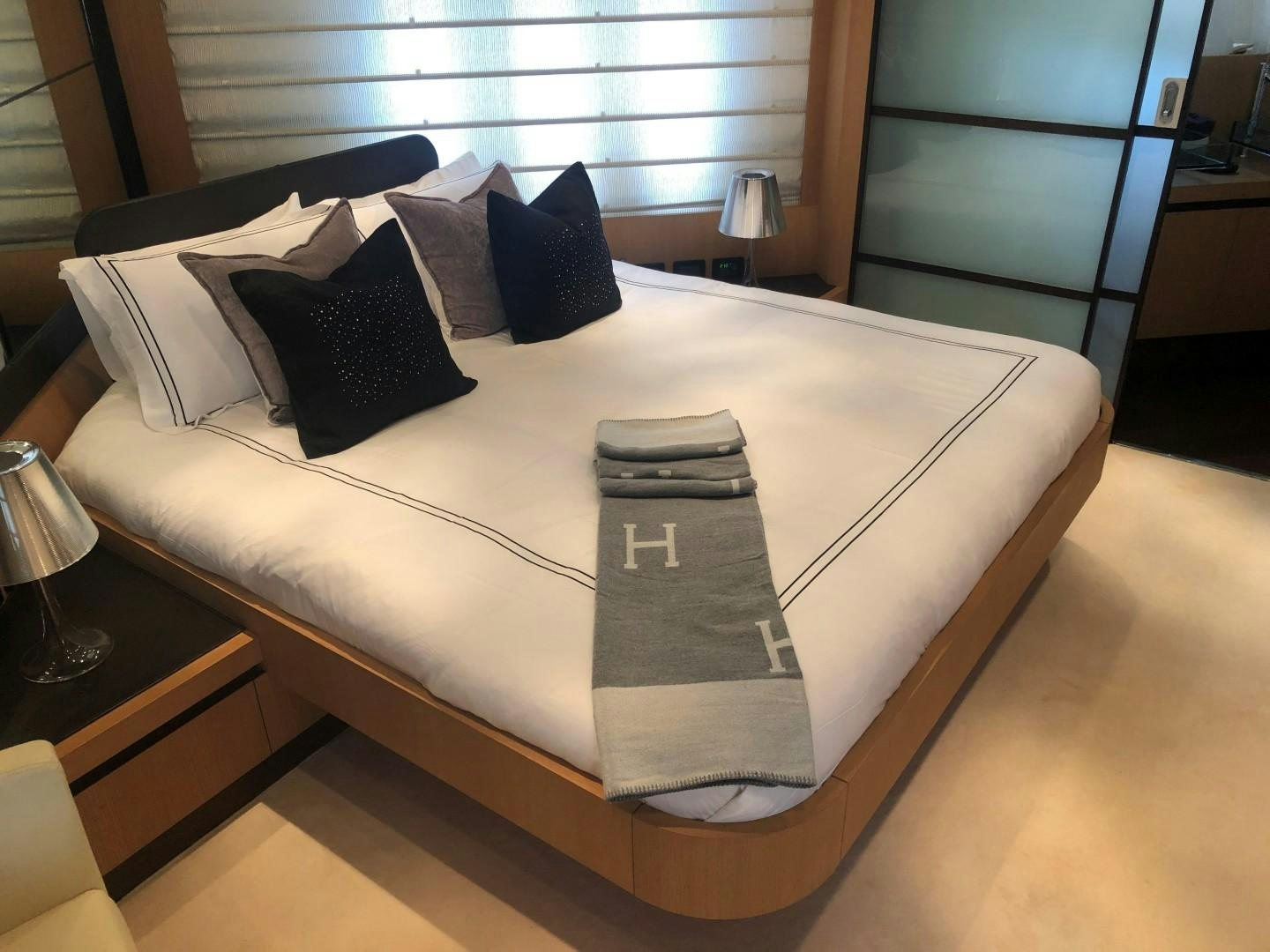 a bed with pillows aboard YCM 90 Yacht for Sale