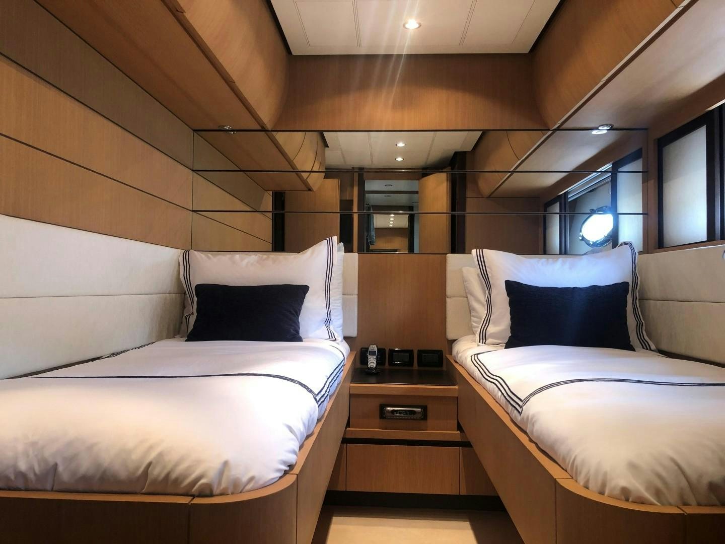 a room with two beds aboard YCM 90 Yacht for Sale