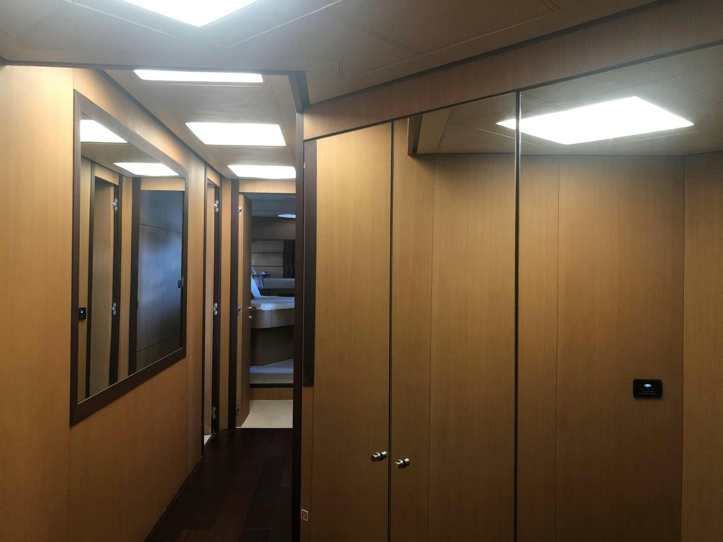 a room with several doors aboard YCM 90 Yacht for Sale