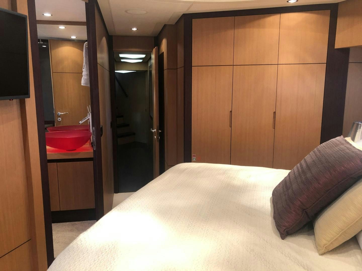 a bed in a room aboard YCM 90 Yacht for Sale