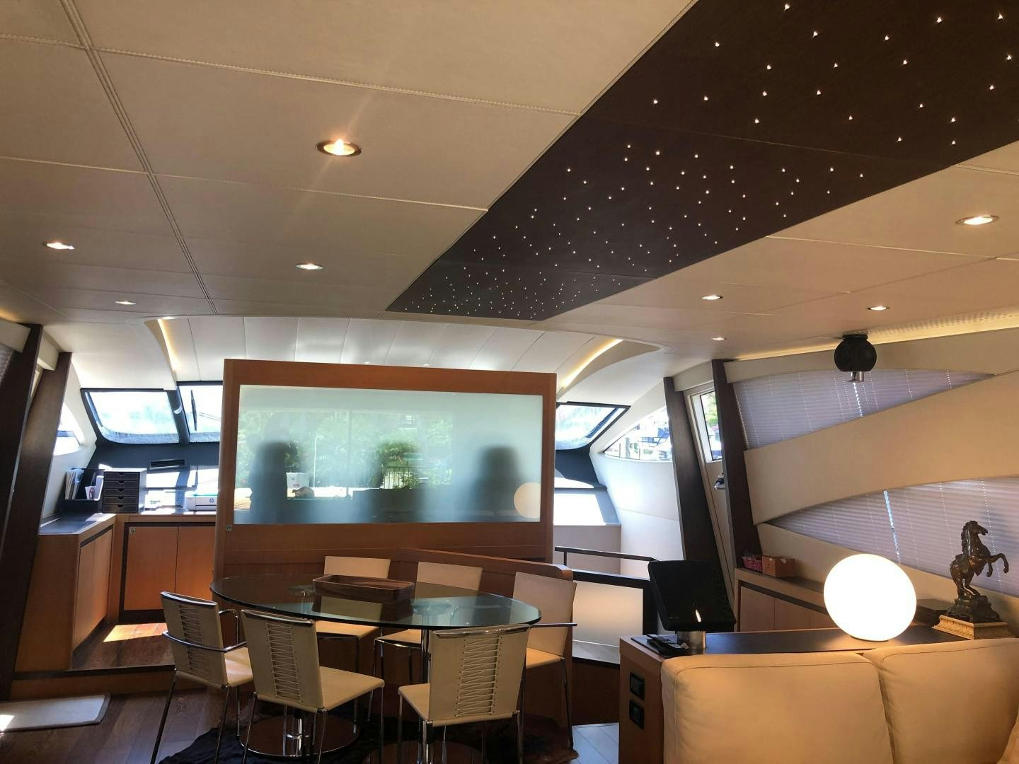 a room with a large screen aboard YCM 90 Yacht for Sale