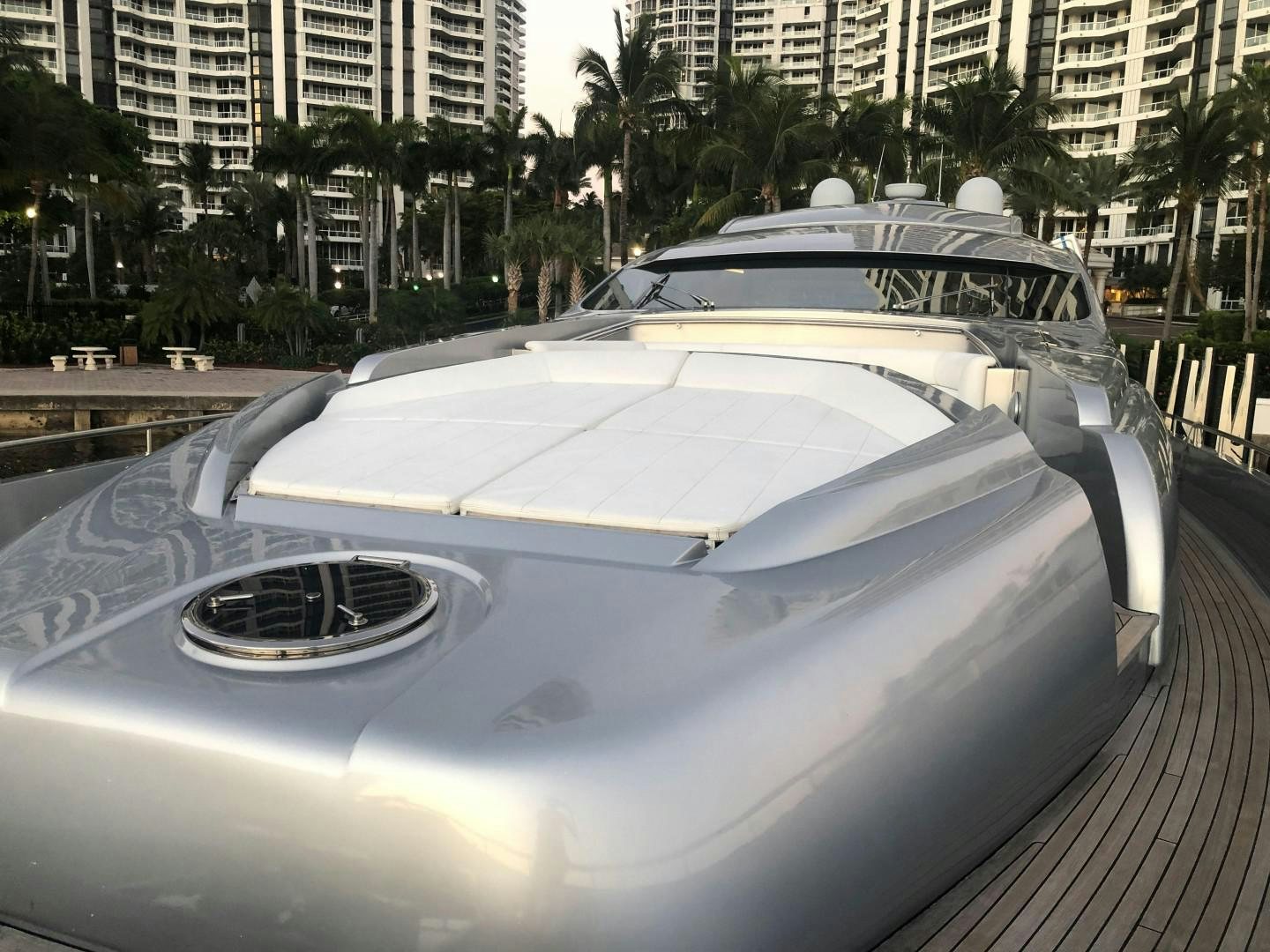 a white sports car parked on a dock aboard YCM 90 Yacht for Sale