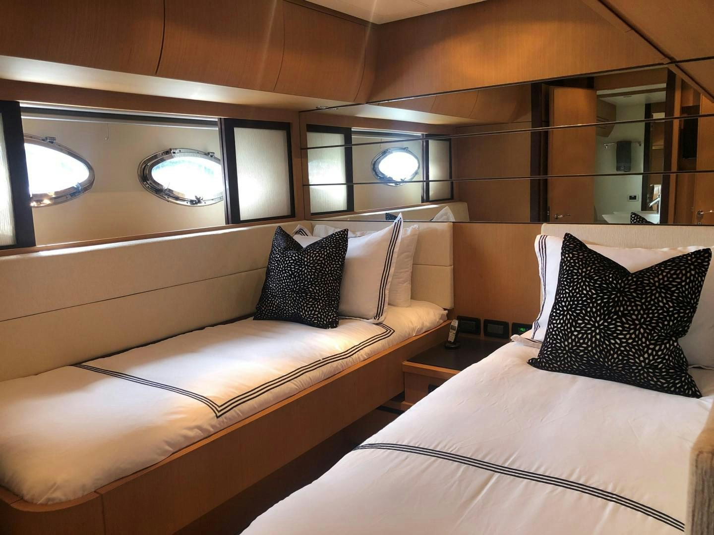 a room with a bed and a mirror aboard YCM 90 Yacht for Sale