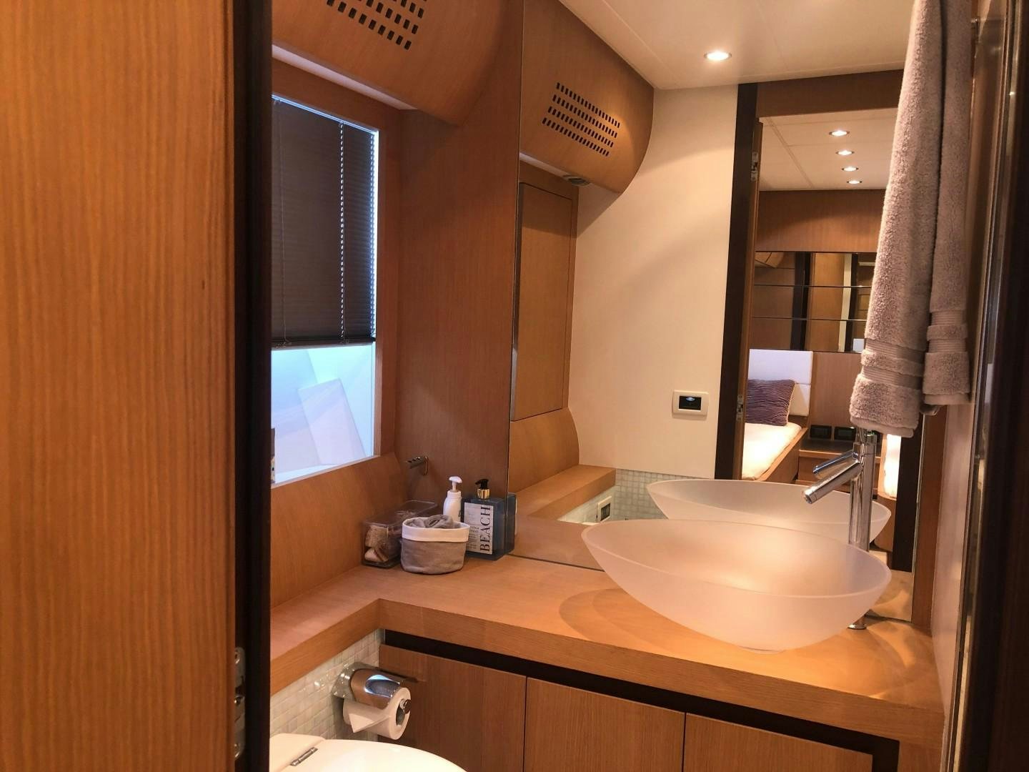 a bathroom with a sink and a mirror aboard YCM 90 Yacht for Sale