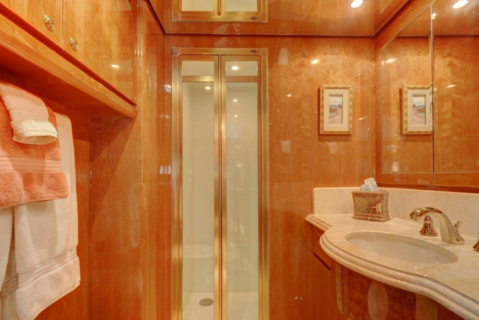 a bathroom with a sink and a shower aboard TEE TIME Yacht for Sale
