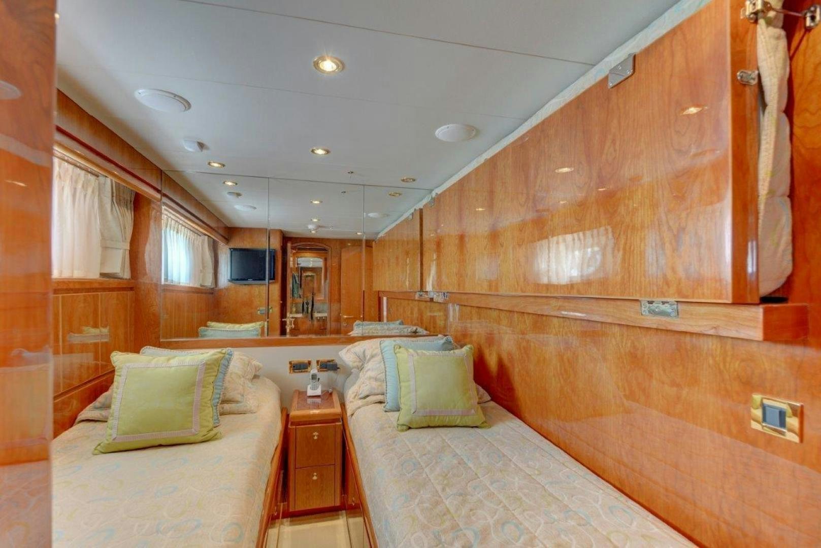 a room with a bed and a table aboard TEE TIME Yacht for Sale