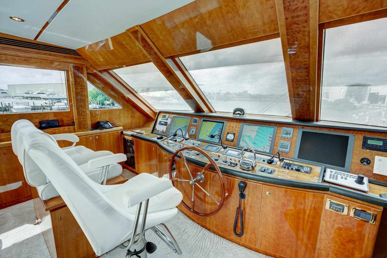 a room with a desk and chairs aboard TEE TIME Yacht for Sale