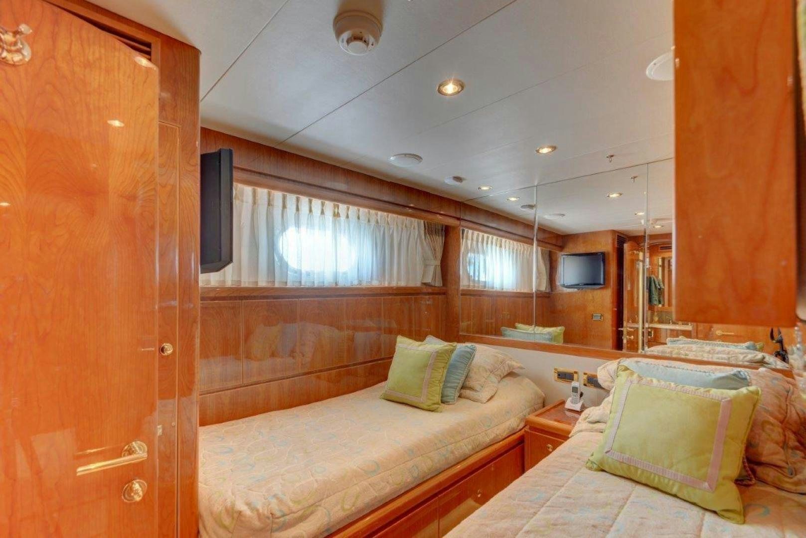 a room with two beds aboard TEE TIME Yacht for Sale