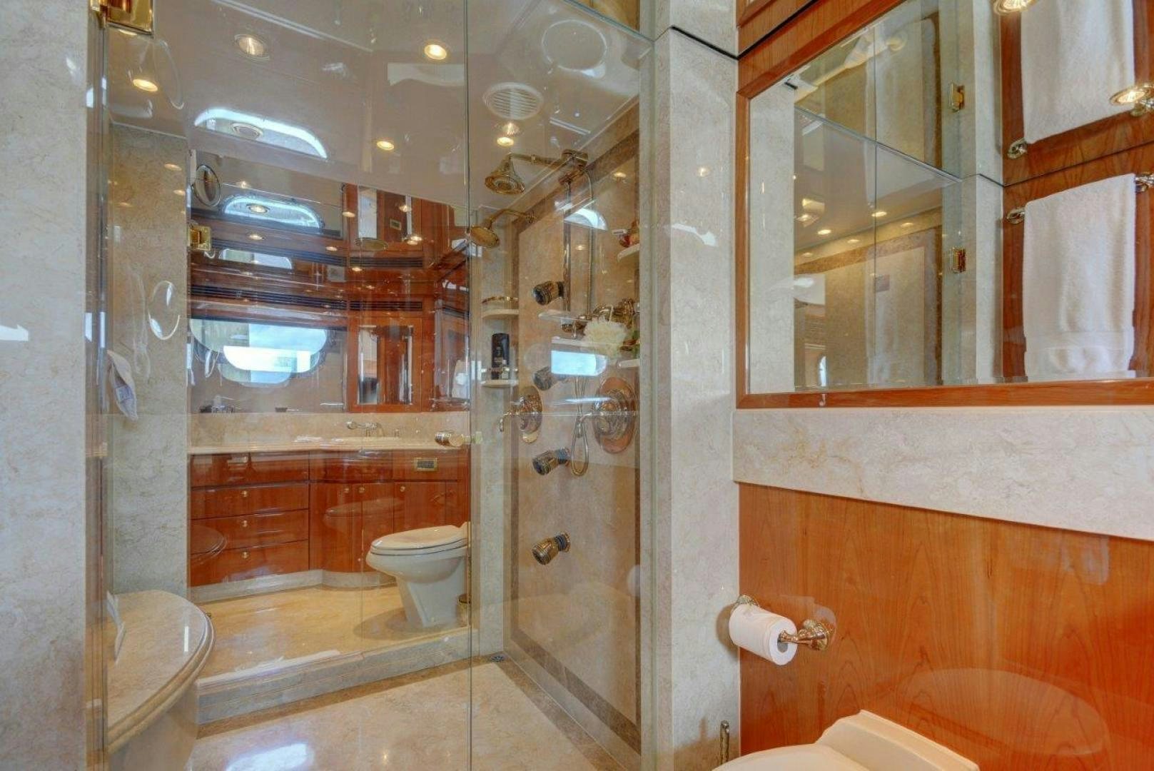 a bathroom with a glass shower aboard TEE TIME Yacht for Sale
