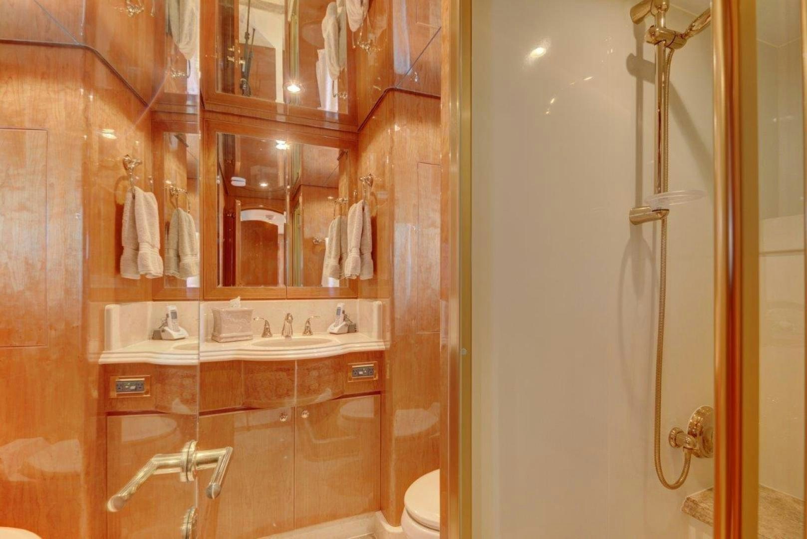 a bathroom with a sink and a mirror aboard TEE TIME Yacht for Sale