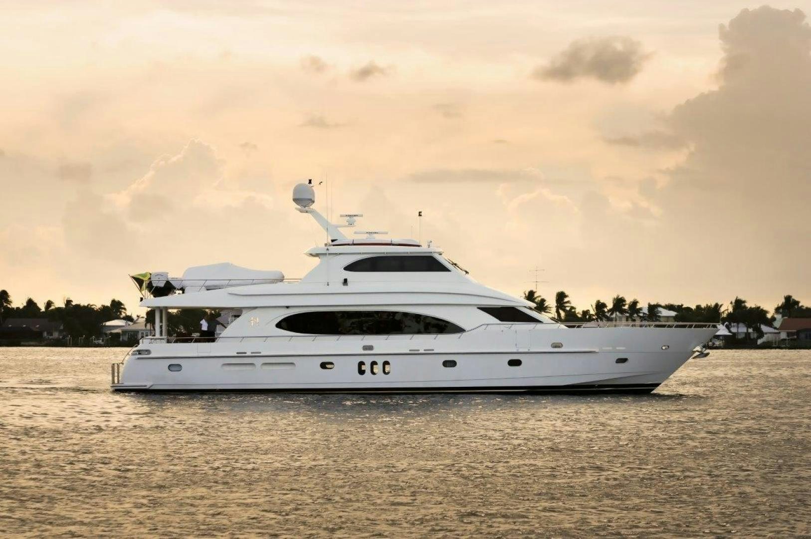 a white yacht on the water aboard TEE TIME Yacht for Sale